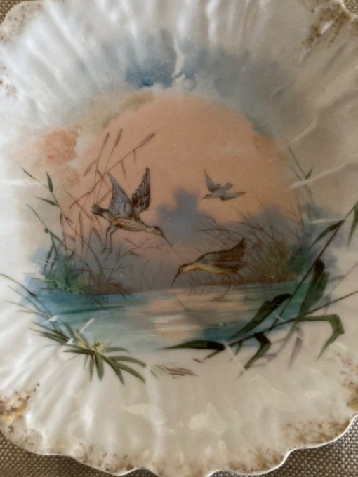 4 assiettes dentelles à décor d oiseaux. Porcelaine de limoges