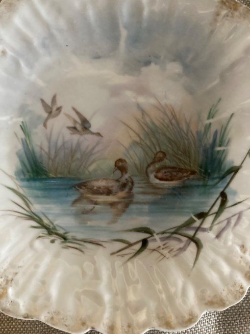 4 assiettes dentelles à décor d oiseaux. Porcelaine de limoges