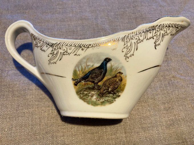 Saucière en porcelaine à décor de faisan et becasses