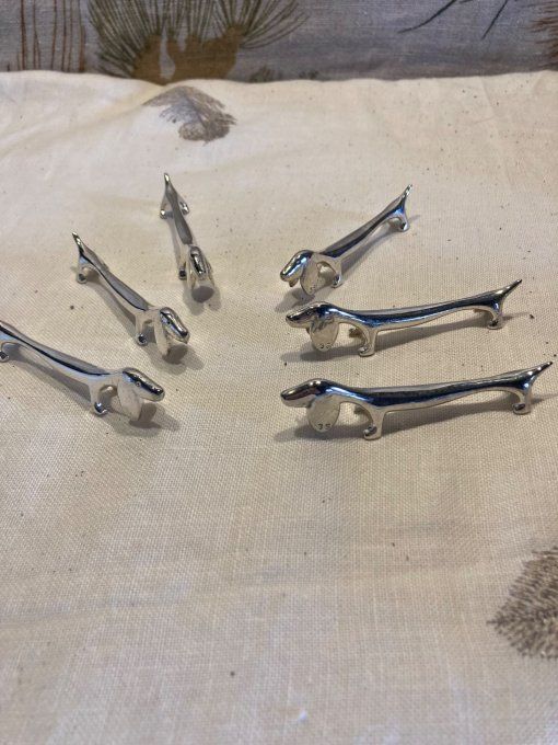 6 porte-couteauxTeckel métal argenté.