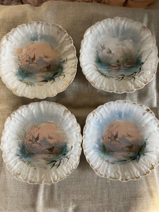4 assiettes dentelles à décor d oiseaux. Porcelaine de limoges